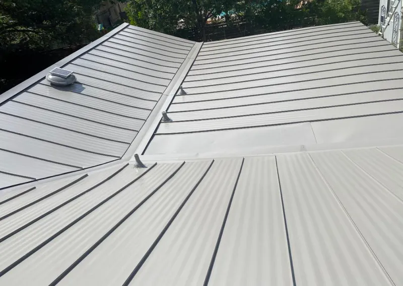 Solar attic fan installed on a metal roof for Roof Ventilation in Leisure World